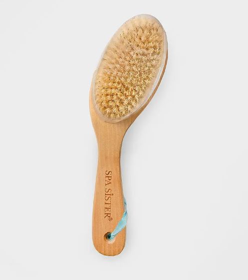 A wooden dry brush with natural bristles and a blue strap, labeled "spa sister," isolated on a white background.