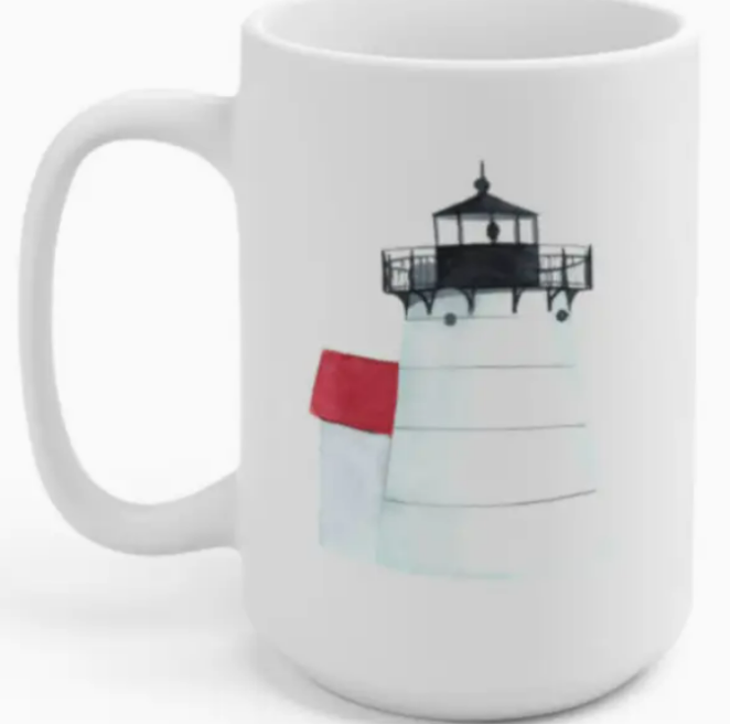 A white mug with a printed illustration of a lighthouse on its surface.